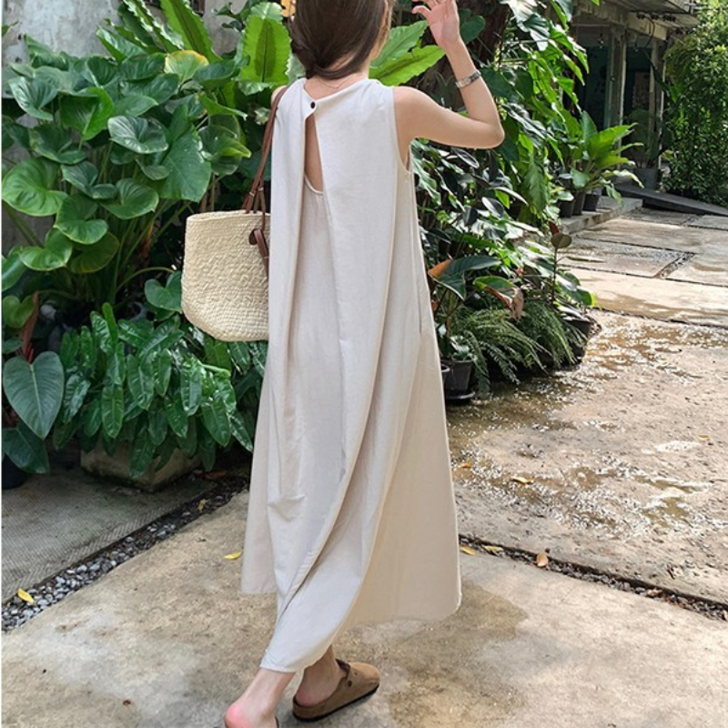 日韓設計感小眾寬鬆顯白露背度假風吊帶連身裙