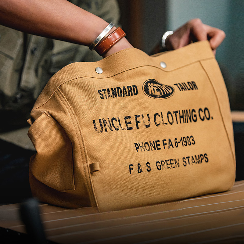 美式復古大容量斜挎報童包字母帆布機車電腦托特郵差包