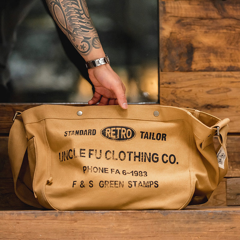 美式復古大容量斜挎報童包字母帆布機車電腦托特郵差包