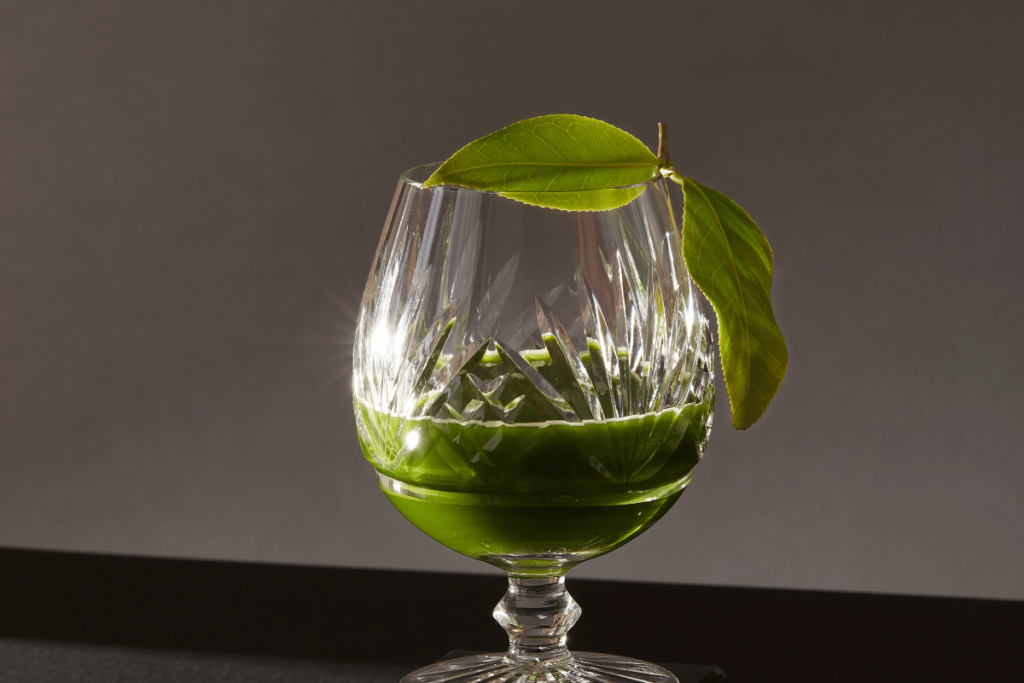 Rare Uji handplucked Matcha made from the Saemidori Cultivar - shaken with ice and poured into a crystal brandy glass 